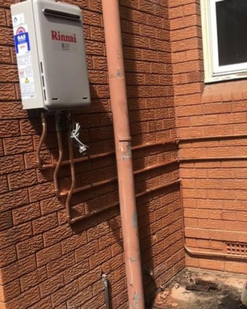 Gas Hot Water On A Brick Wall — ABSO Plumbing